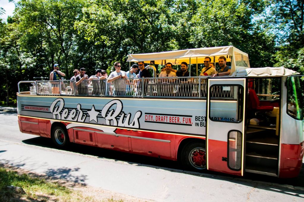 tourists having fun on the beer bus